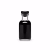Petit flacon en verre rempli d'encre de seiche noire brillante
